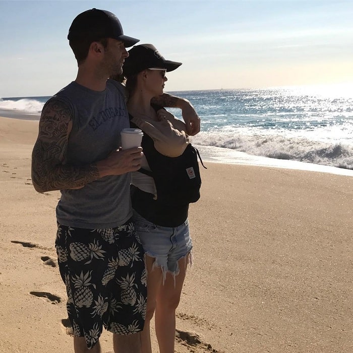 A picture of Adam Levine and his wife, Behati Prinsloo with their daughter.